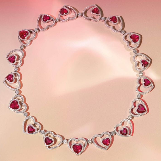 Heart-shaped ruby bracelet set in a gemstone box.