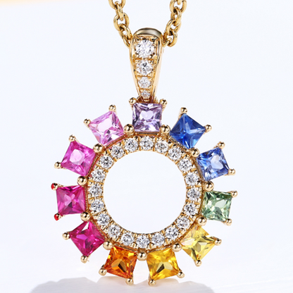 Princess cut colored sapphire pendant set in a gemstone box.