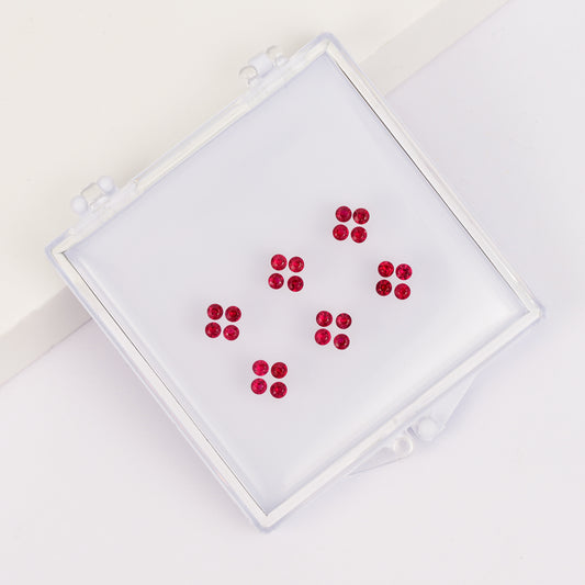 Four-leaf clover ring set with round sapphire stones in a box