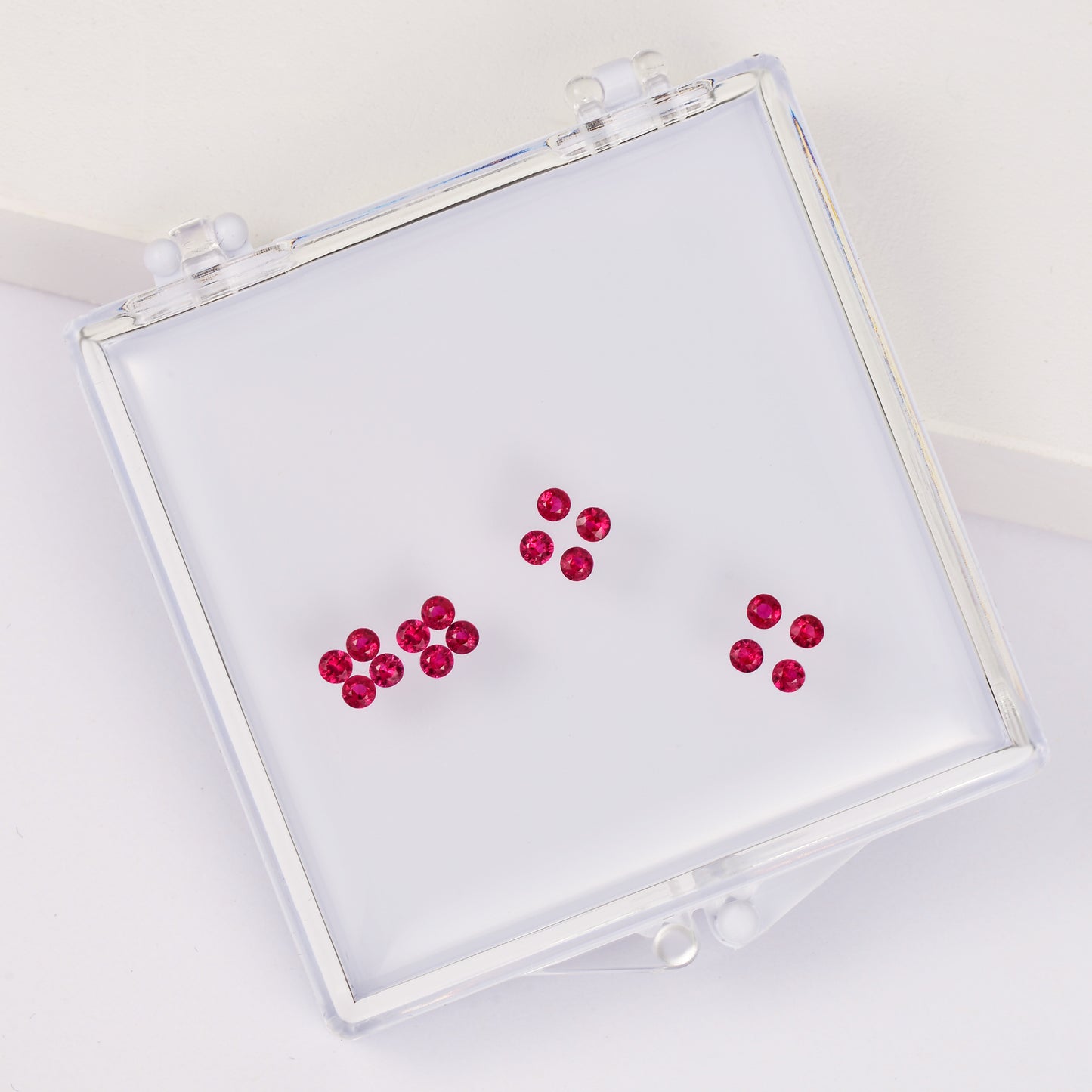 Gemstone set box with round ruby four-leaf clover set.