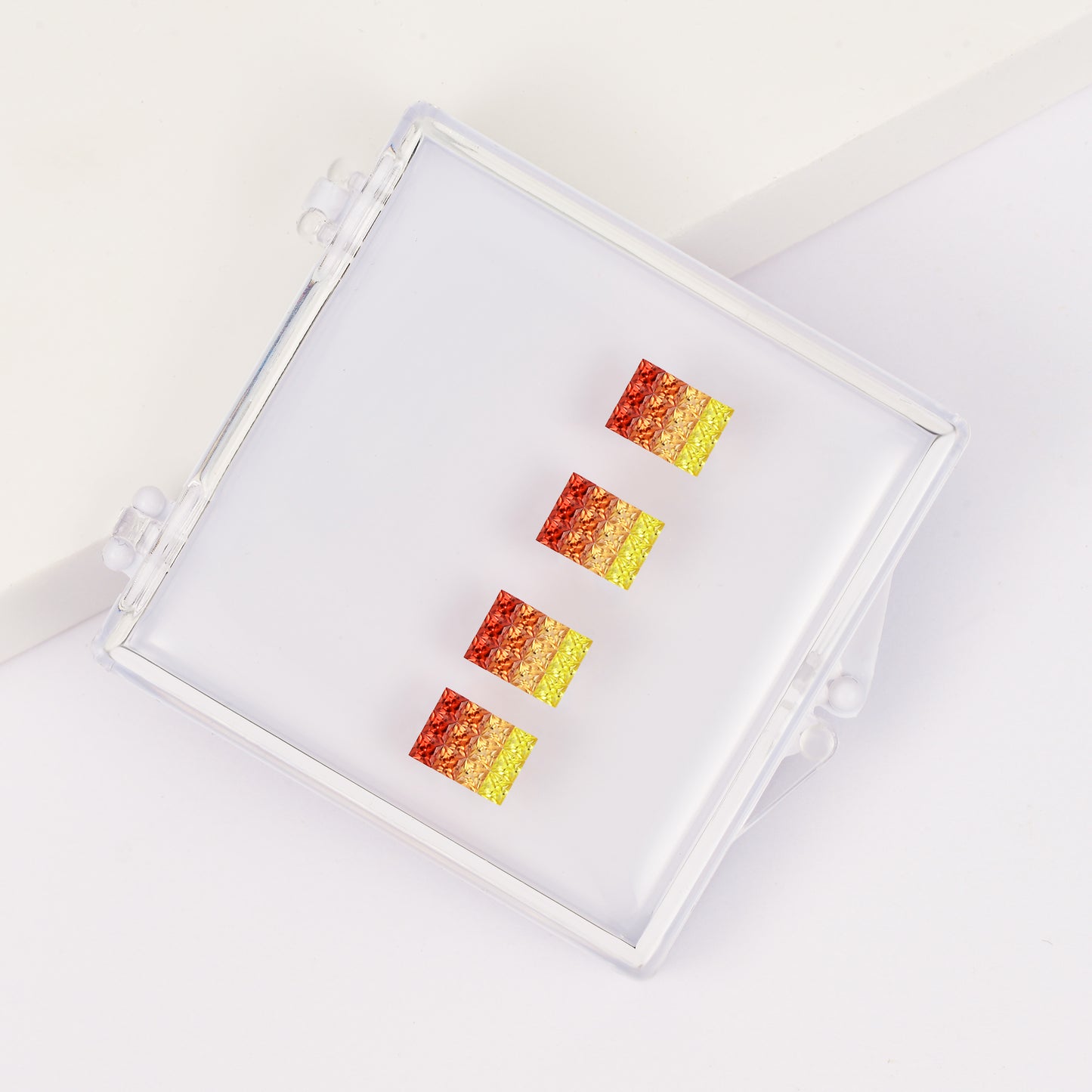 Princess-cut orange sapphire gradient pendant set in a gemstone box