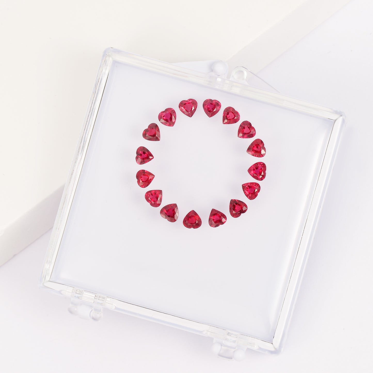 Heart-shaped ruby bracelet set in a gemstone box.