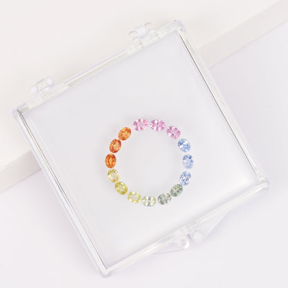 Gemstone set box with 3*4mm oval colored sapphire cluster ring.