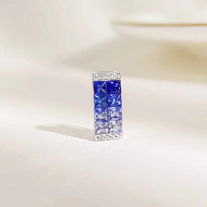 Princess cut sapphire gradient color pendant set in a stone box