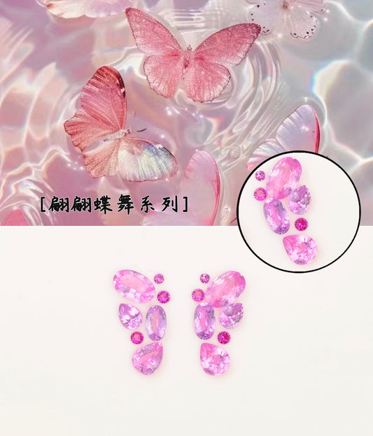 Pinkish purple sapphire butterfly with gemstone setting