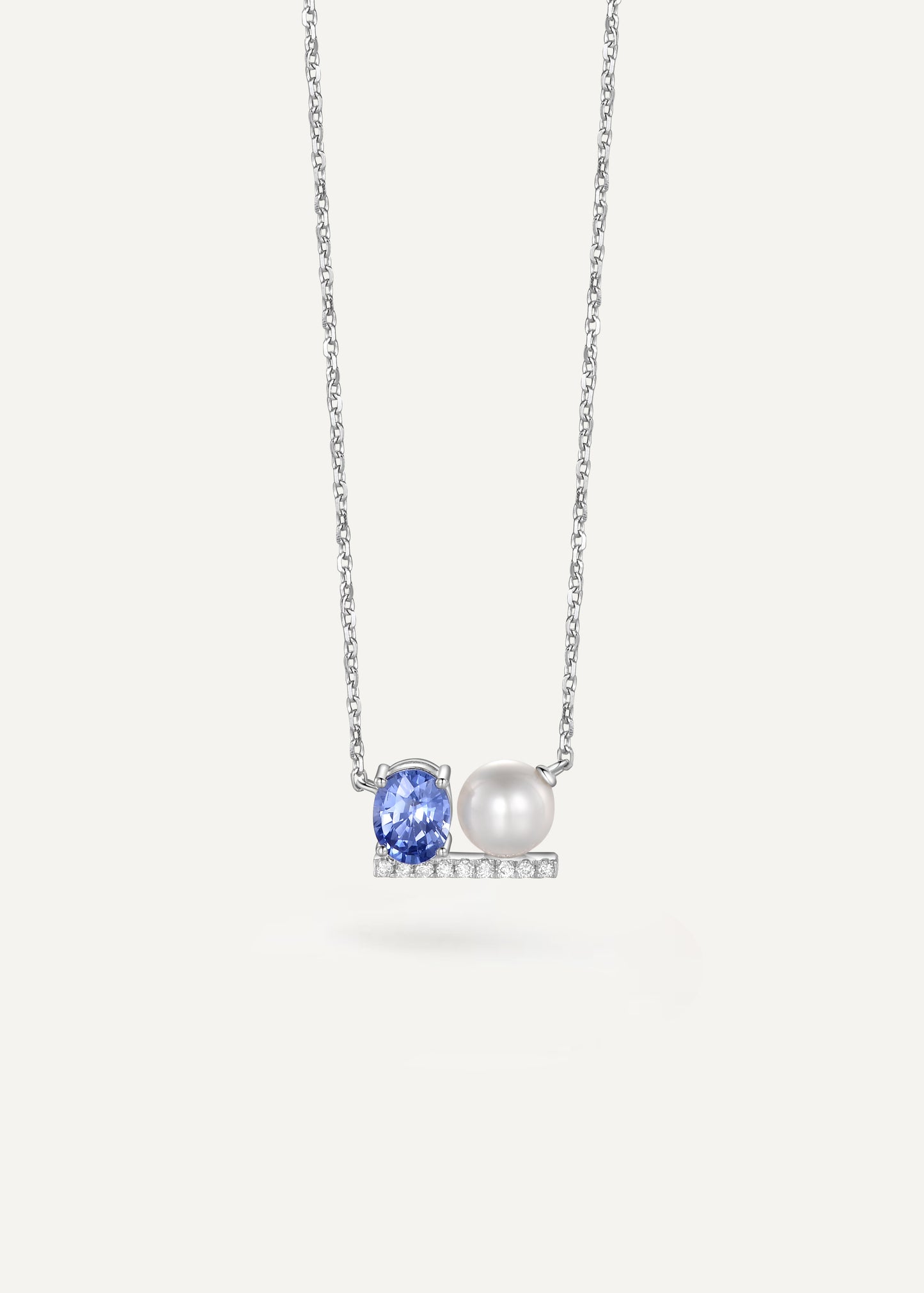 Blue sapphire and pearl reversible double-sided necklace in 18K white gold